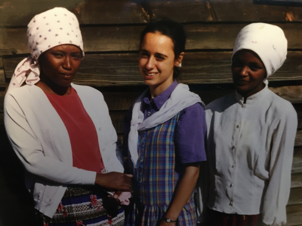 posing with girls in Kenya, globally conscious